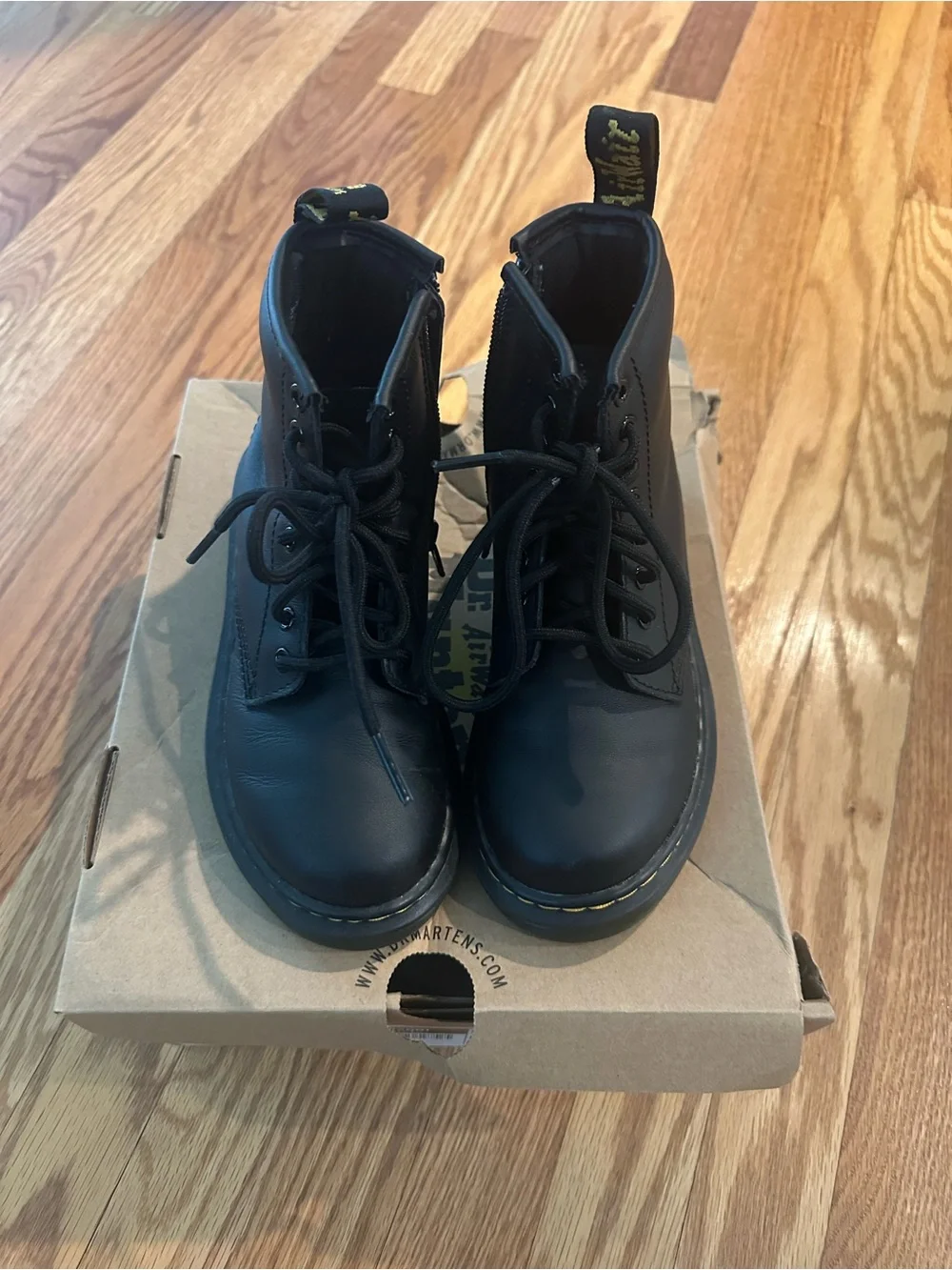 Kids Dr. Martens Black Leather 8-Eye Lace-Up Boots with Yellow Stitching